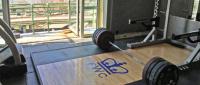 A weightlifting setup with a barbell at Free Weight Club.